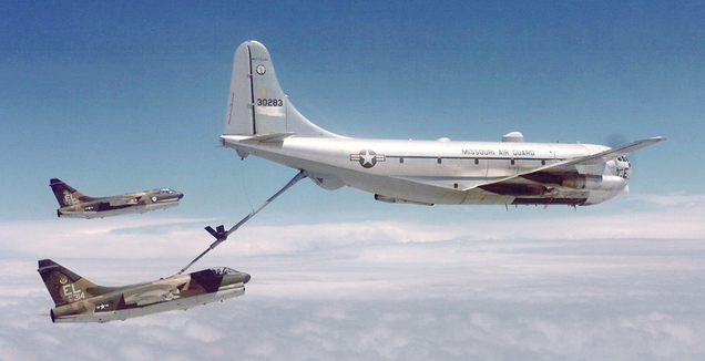 A KC-97L of the Missouri Air Guard refuels a pair of Vought A-7D Corsair IIs.